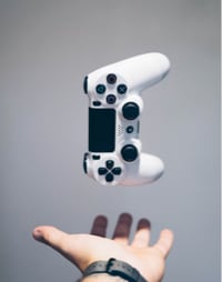 hand catching a gamepad